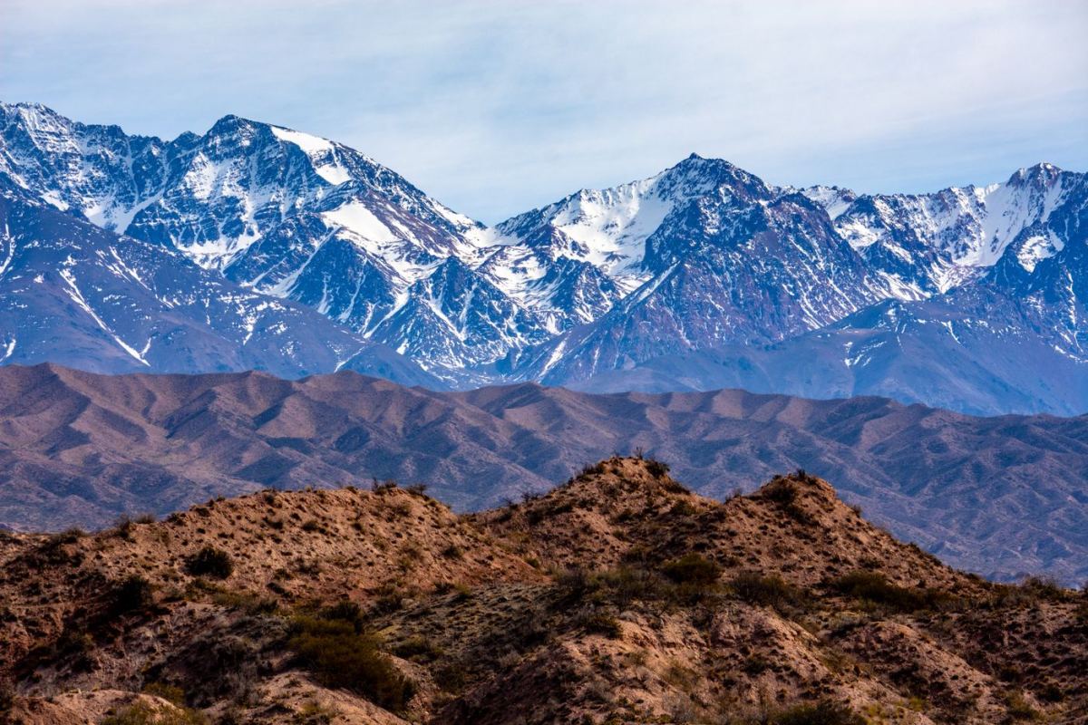 Snow-capped Andes above high-altitude hills